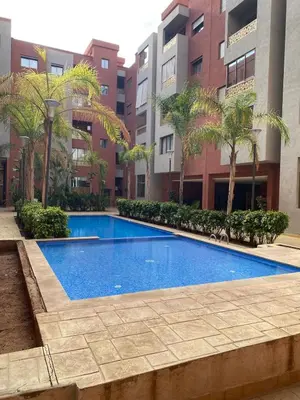 a swimming pool in the middle of a building at Very nice apartment on Route de Casa in Marrakech