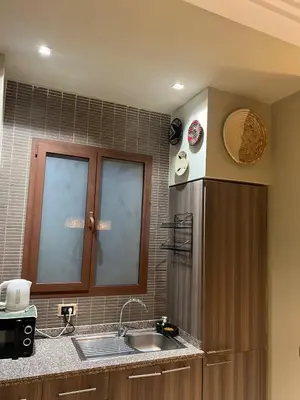 a kitchen with a sink and a counter top at Duplex Le Vizir for 6 with Park Access 3 Pools in Dar Caïd Layadi