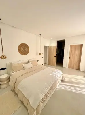 a large white bedroom with a large bed in it at Villa 289- Charme Balinais in Marrakech