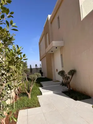 a building with a walkway next to a building at Villa 289- Charme Balinais in Marrakech