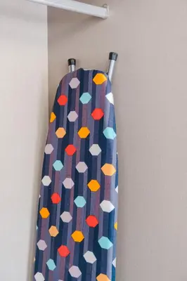 a tie is hanging on a wall with a curtain at Charming Apartment Guéliz Pool-Parking 24h-7j Security 10 a pied de M Avenue in Marrakech