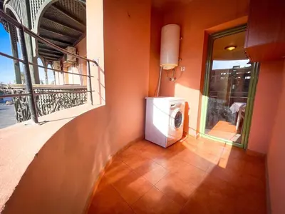 a washing machine in a room with a balcony at Majorelle Cozy Apartment Garden 2-Balcony Downtown in Marrakech