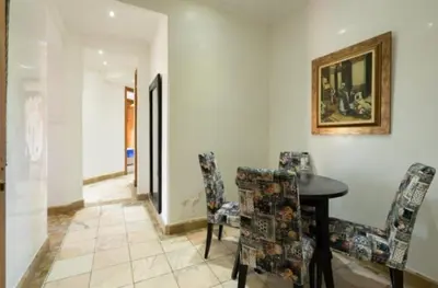 a dining room with a table and chairs at Palmeraie Village 2 in Marrakech