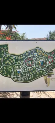a map of a park on a sign at Palmeraie Village 2 in Marrakech