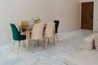a dining room with a table and chairs at Villa Sérénité Marrakech in Marrakech