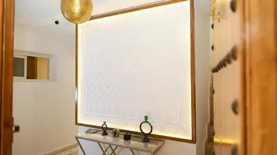 a large window in a room with a table at Riad Reflet D'orient Marrakech in Marrakech