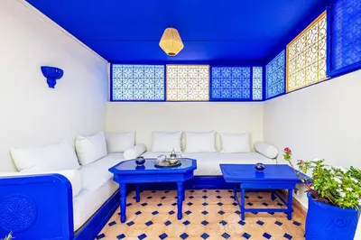 a living room with a white couch and blue tables at 2BR Medina Home with Roof Terrace in Marrakech