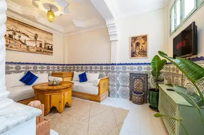 a living room with a couch and a table at 2BR Medina Home with Roof Terrace in Marrakech