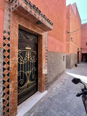 a black door on the side of a building at Apartment with rooftop access in Marrakech