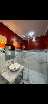 a bathroom with a sink and a shower at Rouge Mamounia in Marrakech