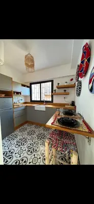 a room with a kitchen with a rug on the floor at Rouge Mamounia in Marrakech