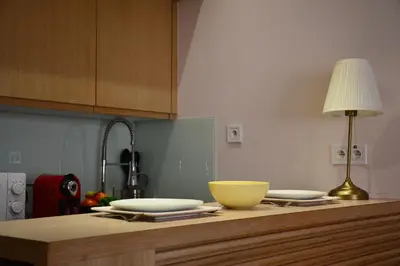a kitchen counter with two bowls and a lamp on it at 1BR Studio-AC & IpTV-Downtown Gueliz-perfect for 2 in Marrakech