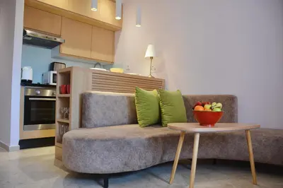 a living room with a couch and a bowl of fruit on a table at 1BR Studio-AC & IpTV-Downtown Gueliz-perfect for 2 in Marrakech