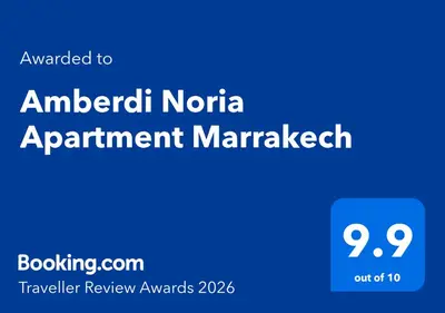 a blue sign with the text upgraded to american natalatalonia apartment management at Amberdi Noria Apartment Marrakech in Marrakech