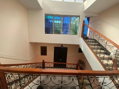 a staircase in a house with a window at Riyad jennah in Marrakech