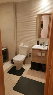 a bathroom with a toilet and a sink at Achraf in Marrakech