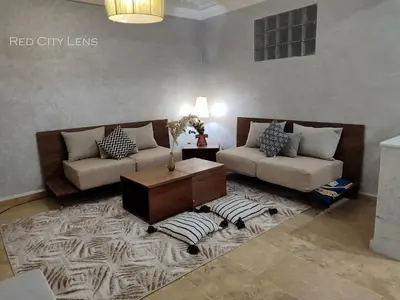 a living room with two couches and a coffee table at Eden Orientale in Marrakech