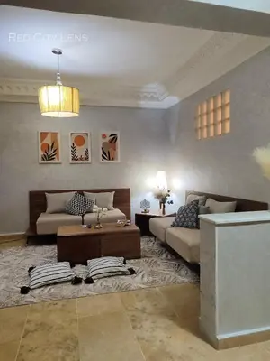 a living room with a couch and a coffee table at Eden Orientale in Marrakech