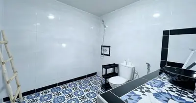 a bathroom with a toilet and a sink at Dar ESSEKIA in Marrakech