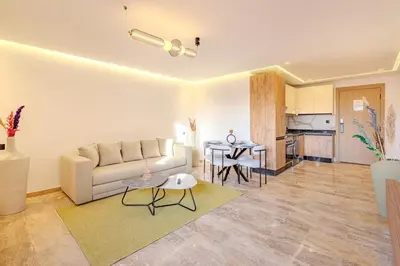 a living room with a couch and a table at 1BR appt in the centre gueliz in Marrakech