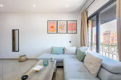 a living room with a couch and a table at Super apartment in marrrakech in Marrakech