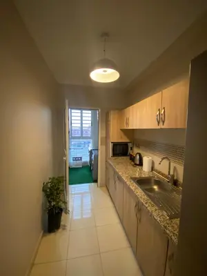 a kitchen with a sink and a counter top at Luxury Apartment Near Airport & Medina in Marrakech