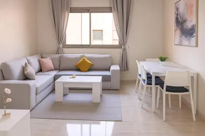 a living room with a couch and a table at Appartement moderne in Marrakech