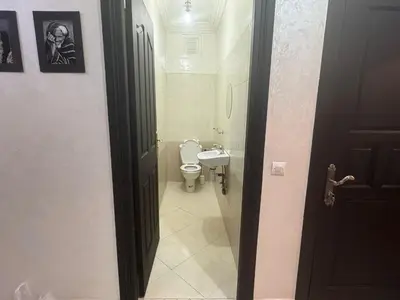 a bathroom with a toilet and a sink at Elegant Apartment in Marrakech Gueliz in Marrakech