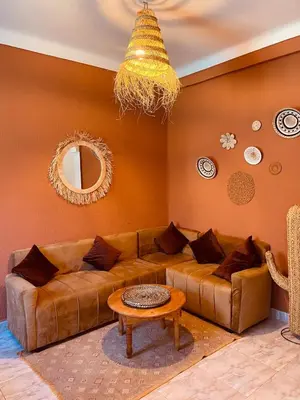 a living room with a couch and a table at Appartement cosy au coeur des souks de Marrakech in Marrakech