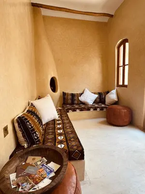 a living room with two couches and a table at Momo House- Riad Zaza in Marrakech