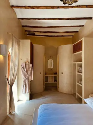 a large bedroom with a bed and a window at Momo House- Riad Zaza in Marrakech