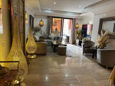 a large living room with a couch and a living room with at Central Fiber Optic Pool in Marrakech