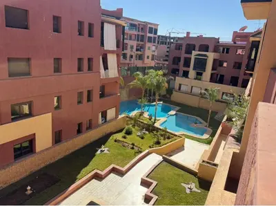 an aerial view of a building with a swimming pool at Central Fiber Optic Pool in Marrakech