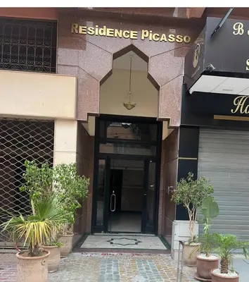 a entrance to a building with a resistance pharmacy at Dar Mezhor apartment in Marrakech