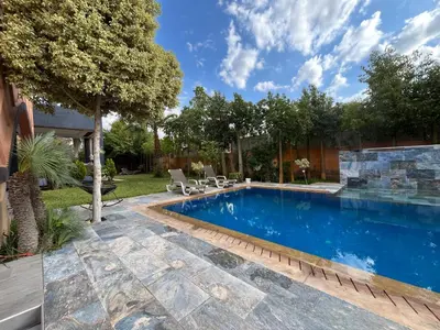 an image of a swimming pool in a yard at Villa palmeraie in Marrakech