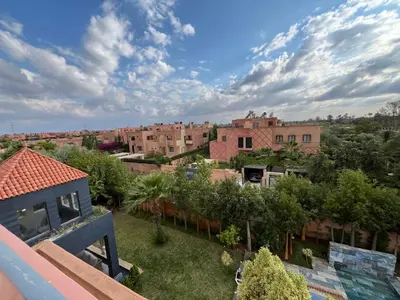 a view of a city from the balcony of a house at Villa palmeraie in Marrakech