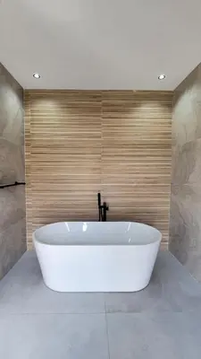 a large white bath tub in a bathroom at Modern Villa Selma in Marrakech