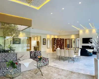 a living room with a couch and chairs and a table at Spacious Villa with Mountain Views - 550 m² in Marrakech