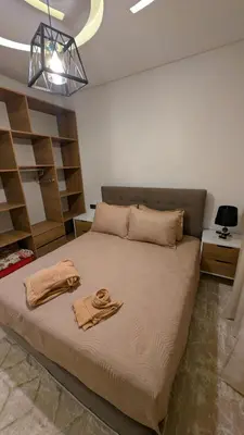 a bedroom with a large bed with two towels on it at Stylish Apart Near City Center in Marrakech