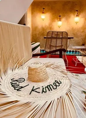 a straw hat sitting on top of a table at Riad Kimme Room 1 in Marrakech