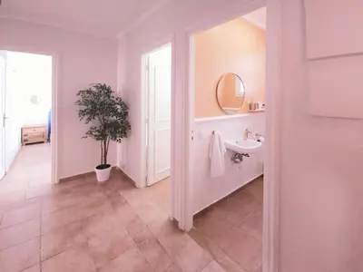 a bathroom with a sink and a mirror at Design Elegant Appartement in Marrakech