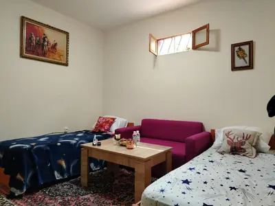 a living room with a couch and a table at غرفة مريحة و نضيفة in Marrakech