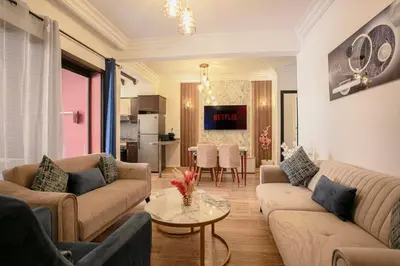 a living room with two couches and a table at Traditionnel Boutique - Marrakech Downtown in Marrakech