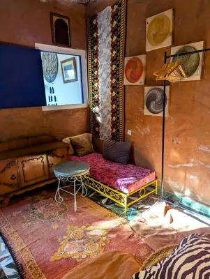 a room with a couch and a table in it at Mandalahome in Marrakech
