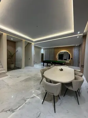 a lobby with a table and a pool table at Villa Maymouna in Marrakech