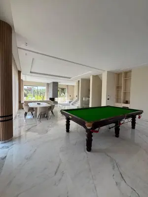 a large room with a pool table in it at Villa Maymouna in Marrakech