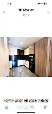 a picture of a kitchen with a black appliance at Duplex haut standing in Marrakech