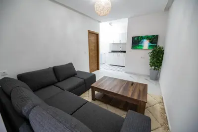 a living room with a couch and a coffee table at Jawhar Appart A4 in Marrakech
