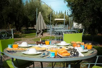 a table with plates of food and drinks on it at Maison safou in Marrakech