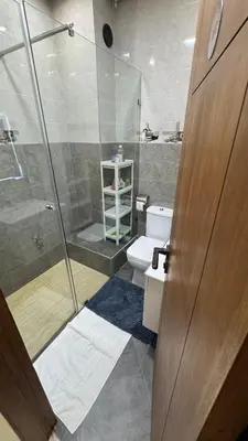 a bathroom with a shower and a toilet and a sink at Le Joyau de la Ville in Marrakech